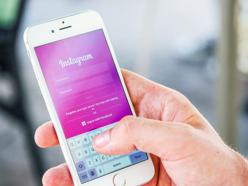 How To Optimize Your Instagram For Business - Photo of A Hand holding a phone with Instagram on it